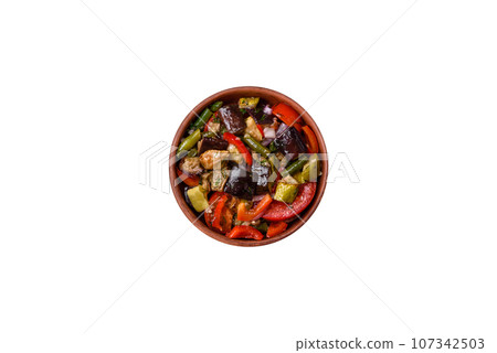 Delicious fresh salad of grilled vegetables peppers, tomatoes, eggplants and zucchini 107342503