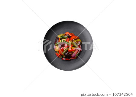Delicious fresh salad of grilled vegetables peppers, tomatoes, eggplants and zucchini 107342504