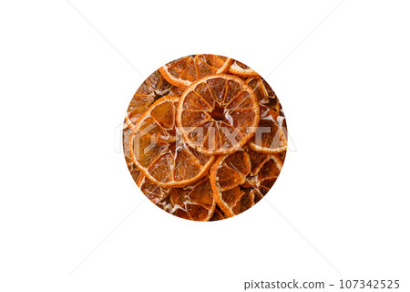 Dried round slices of tangerine, orange or lemon on a dark concrete background 107342525