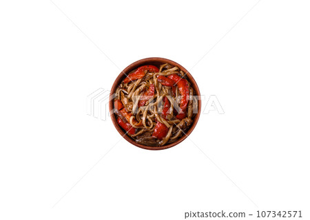 Delicious asian udon dish with vegetables, mushrooms, salt and spices Delicious asian udon dish with vegetables, mushrooms, salt and spices 107342571