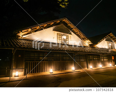 Beautiful illuminated Sankyo Warehouse in Sakata City in the summer, a historic building 107342818
