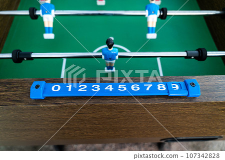 Close-up of figures of plastic players in a football match. 107342828