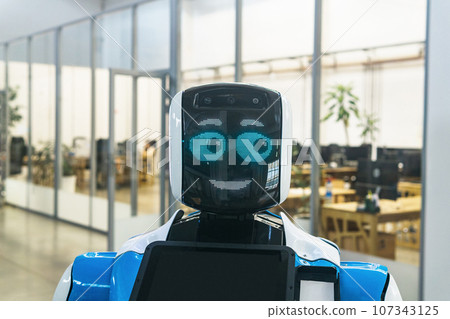 humanoid robot guide expressing emotions against the background of office interior humanoid robot guide expressing emotions against the background of office interior 107343125
