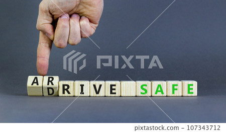 Drive and arrive safe symbol. Concept words Drive safe Arrive safe on wooden blocks. Beautiful grey table grey background. Businessman hand. Business drive and arrive safe concept. Copy space. Drive and arrive safe symbol. Concept words Drive safe Arrive safe on wooden blocks. Beautiful grey table grey background. Businessman hand. Business drive and arrive safe concept. Copy space. 107343712