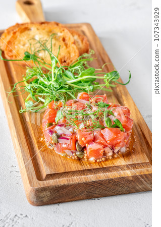 Portion of salmon tartare 107343929
