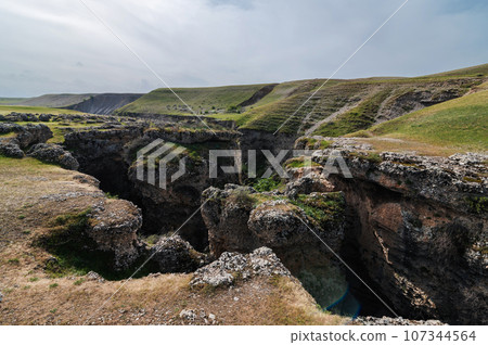 Landscape with valley with gorge of Aksu canyon in Kazakhstan in spring Landscape with valley with gorge of Aksu canyon in Kazakhstan in spring 107344564