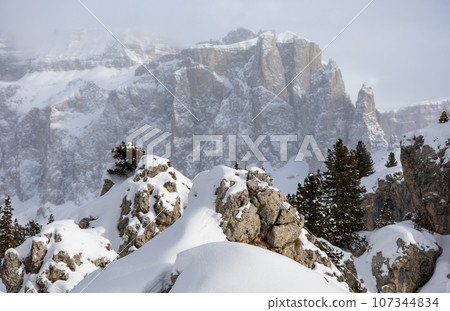Winter Italy Dolomite mountains covered with snow  107344834