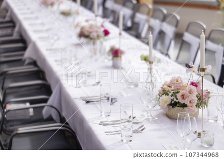Wedding table with pink flowers Wedding table with pink flowers 107344968