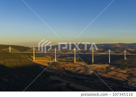 Multi-span cable stayed Millau Viaduct across gorge valley of Tarn River, Aveyron Departement, France Multi-span cable stayed Millau Viaduct across gorge valley of Tarn River, Aveyron Departement, France 107345118
