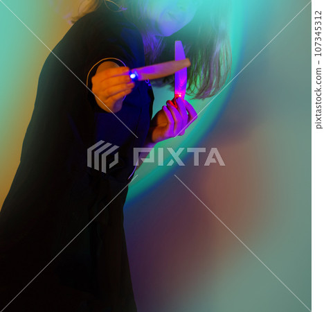 Manicurist influencer blogger with nail files in her hands. Manicurist influencer blogger with nail files in her hands. 107345312