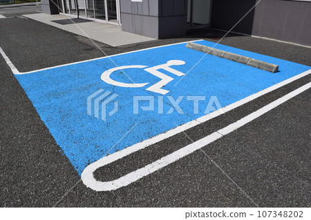 Wheelchair mark caring parking lot 107348202