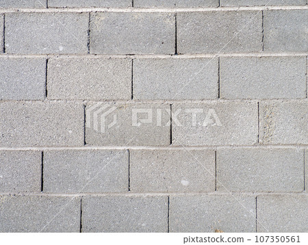 Stone gray masonry. Wall. Strong fence. Background from cement blocks. Stone gray masonry. Wall. Strong fence. Background from cement blocks. 107350561
