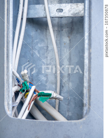 Wires inside. Wrapped contacts. Electrical safety. Tape wrapping wires. Electricity of the net. S Wires inside. Wrapped contacts. Electrical safety. Tape wrapping wires. Electricity of the net. S 107350878