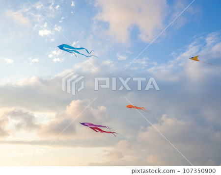 Lots of kites in the sky. Kite Festival. Colorful toys. Launching kites. Beauty in the sky Leisure entertainment. 107350900