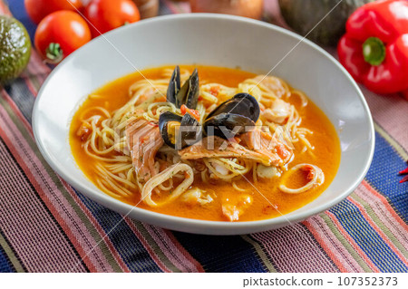 Mediterranean soup pasta with plenty of seafood Mediterranean soup pasta with plenty of seafood 107352373