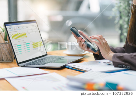 Advisor financial business analytics woman analyzing data charts, graphs, and a dashboard on laptop screen. Data analysis concept 107352926