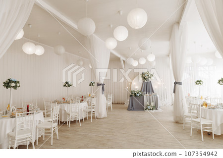 A view inside a marquee set up for a wedding reception 107354942