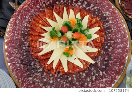 Classic Croatian starter plate with Fine Croatian sliced salami and cheese Classic Croatian starter plate with Fine Croatian sliced salami and cheese 107358174