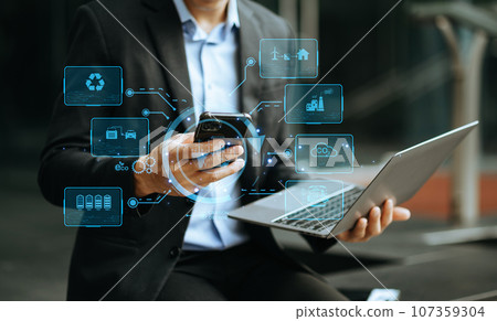 Businessman working virtual tablet computer twith reduce CO2 concept with icons, global warming such as reforest green factory recycle in office. 107359304