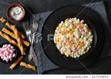 Ambrosia Salad in black bowl, top view Ambrosia Salad in black bowl, top view 107359654