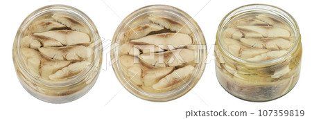 Sliced salted and pickled herring fish in jar isolated on white background.  107359819