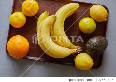 Fresh fruit on wooden tray 107360287
