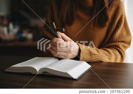 Woman praying on holy bible in the morning.Woman hand with Bible praying. Christian life crisis prayer to god. in sun light.Woman praying on holy bible in the morning.Woman hand with Bible praying. Woman praying on holy bible in the morning.Woman hand with Bible praying. Christian life crisis prayer to god. in sun light.Woman praying on holy bible in the morning.Woman hand with Bible praying. 107361200