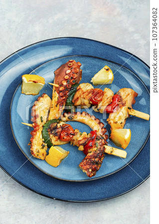 Octopus skewers, sea delicacy. Octopus skewers, sea delicacy. 107364082
