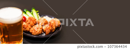 Karaage and beer are classic menu items at izakaya Karaage and beer are classic menu items at izakaya 107364434