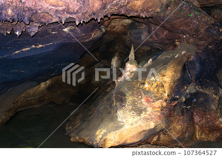 Stalactite, stalagmite walls of the cave. Template for design. Stalactite, stalagmite walls of the cave. Template for design. 107364527