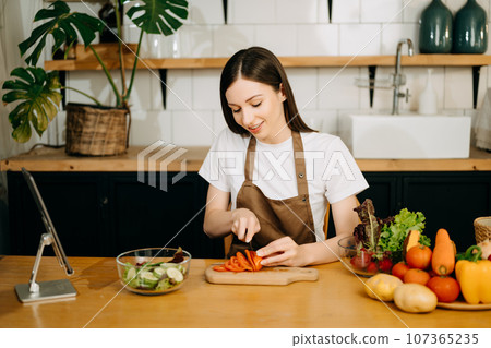 image of asian woman preparing salad in the kitchen and healthy food in bowl e image of asian woman preparing salad in the kitchen and healthy food in bowl e 107365235