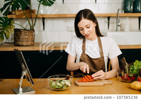 image of asian woman preparing salad in the kitchen and healthy  food in bowl e 107365236
