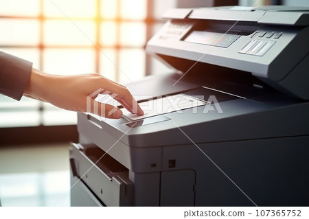 Photo of office's people using multifunction printer 107365752