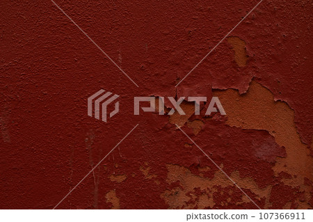 Dark red painted old wall plaster texture background 107366911