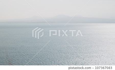 Sevan lake in October on a hazy day 107367083