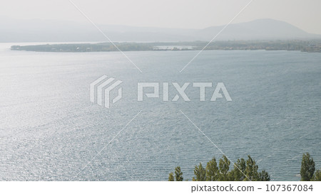 Sevan lake in October on a hazy day 107367084