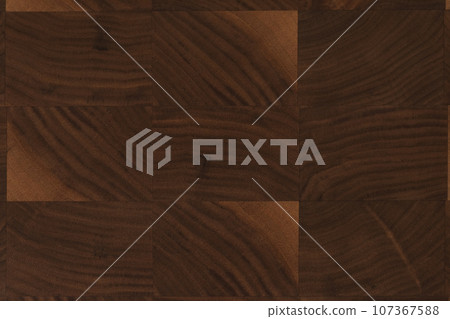 Black walnut end grain wood cutting board texture with oil finish closeup Black walnut end grain wood cutting board texture with oil finish closeup 107367588