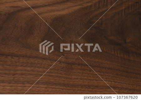 Black walnut wood texture with oil finish closeup 107367620