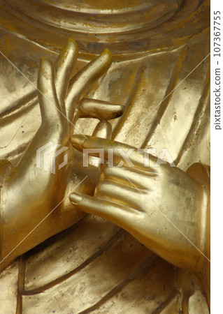Close up on Buddha's praying hands 107367755