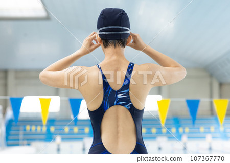 Woman swimming in the pool 107367770