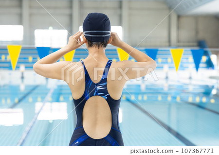 Woman swimming in the pool 107367771
