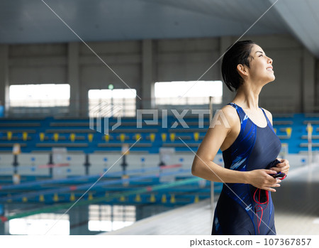 woman going to the pool woman going to the pool 107367857