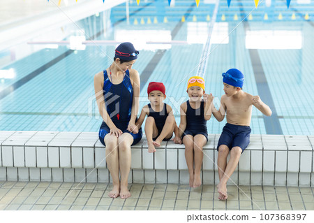 children attending swimming school children attending swimming school 107368397