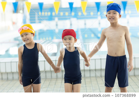 children going to the pool 107368899