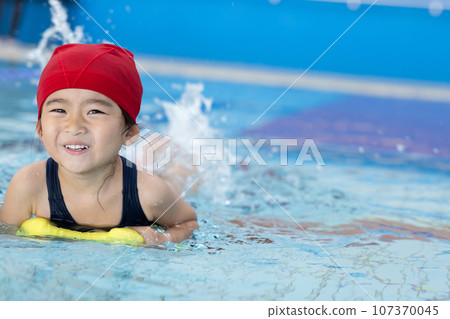 cute girl going to the pool 107370045