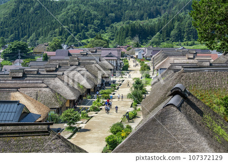 Summer townscape of Ouchi-juku, a popular tourist destination in Minamiaizu District, Fukushima Prefecture Summer townscape of Ouchi-juku, a popular tourist destination in Minamiaizu District, Fukushima Prefecture 107372129