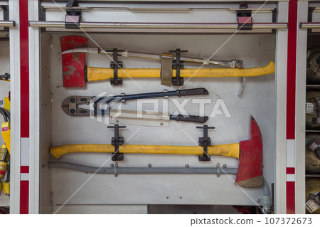 firefighter tools hatchet, axe, cutters emergency firetruck equipment 107372673