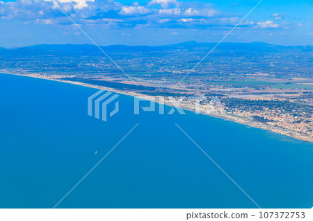 View from a flying plane on Fiumicino bay and the Tyrrhenian sea, Italy View from a flying plane on Fiumicino bay and the Tyrrhenian sea, Italy 107372753