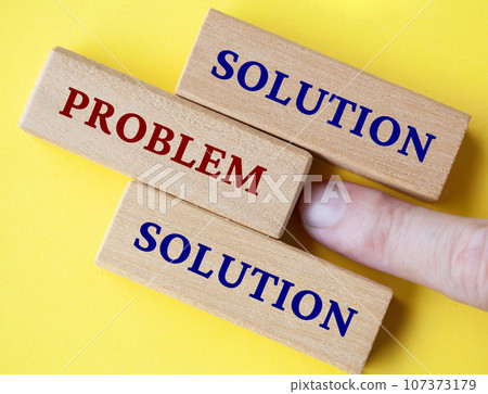 Hand pushing wooden block with text, problem. Solutions to problems concept 107373179