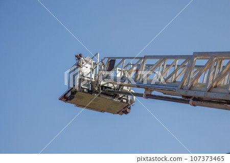 firefighter ladder nacelle platform firetruck climbing equipment on blue sky firefighter ladder nacelle platform firetruck climbing equipment on blue sky 107373465